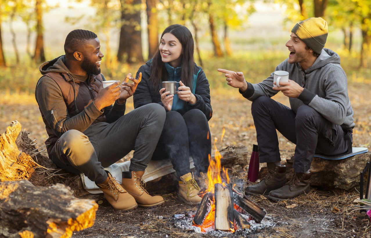 Friends camping together in the fall